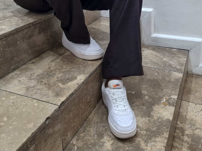 Sitting on steps in white sneakers with Tekkie Ties no-tie laces