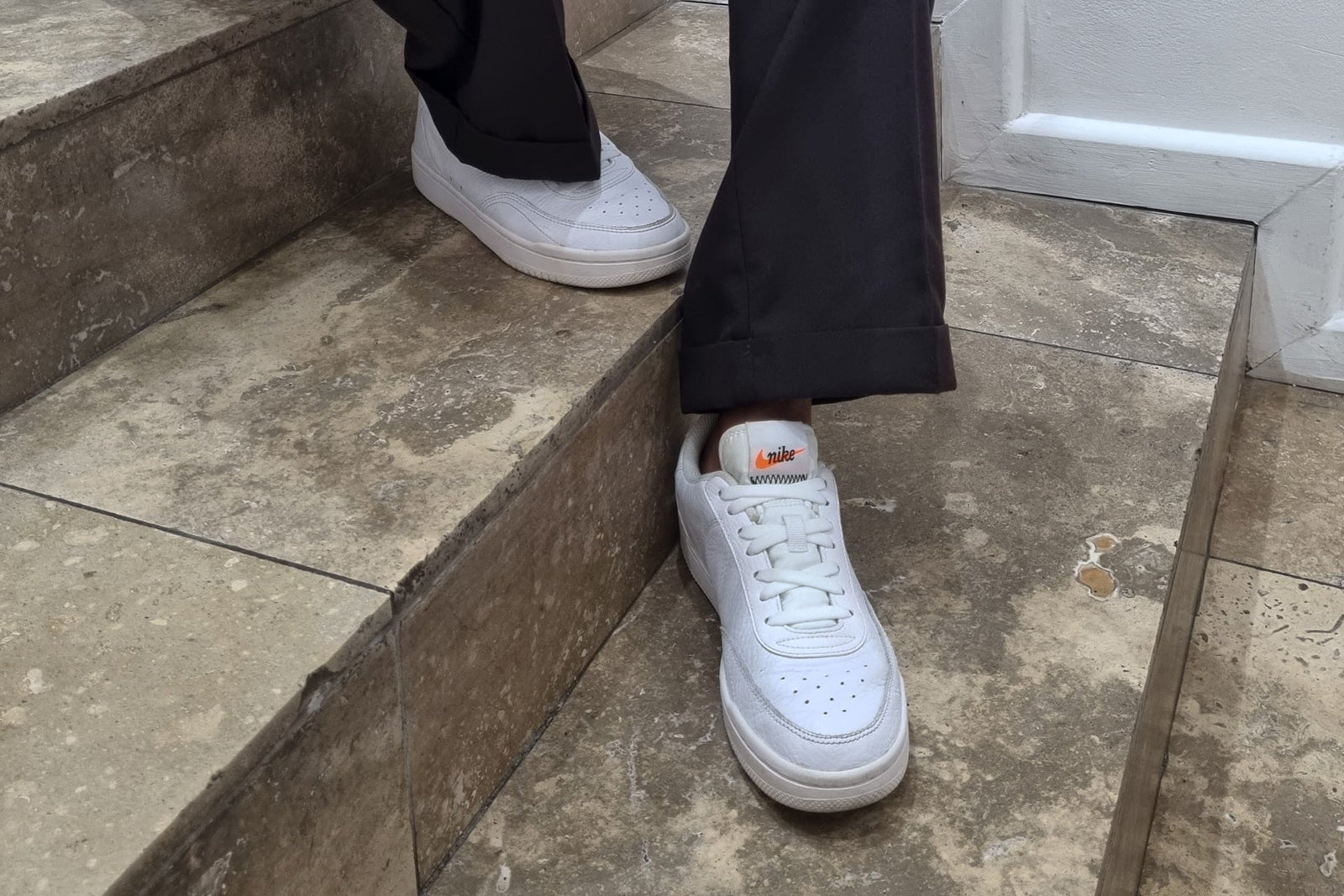 Sitting on steps in white sneakers with Tekkie Ties no-tie laces