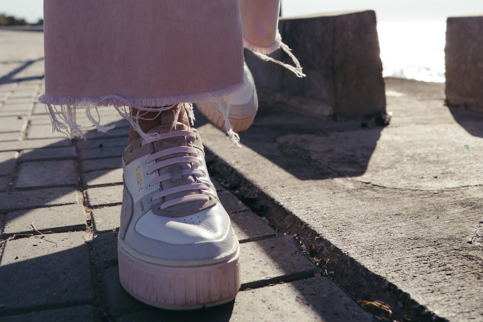 White sneaker with Tekkie Ties no-tie laces in the sun
